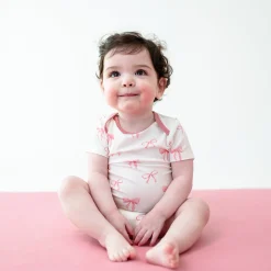 Sale Kyte Baby Bodysuit in Bow