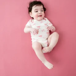 Sale Kyte Baby Bodysuit in Bow