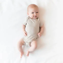 Online Kyte Baby Bodysuit in Oat
