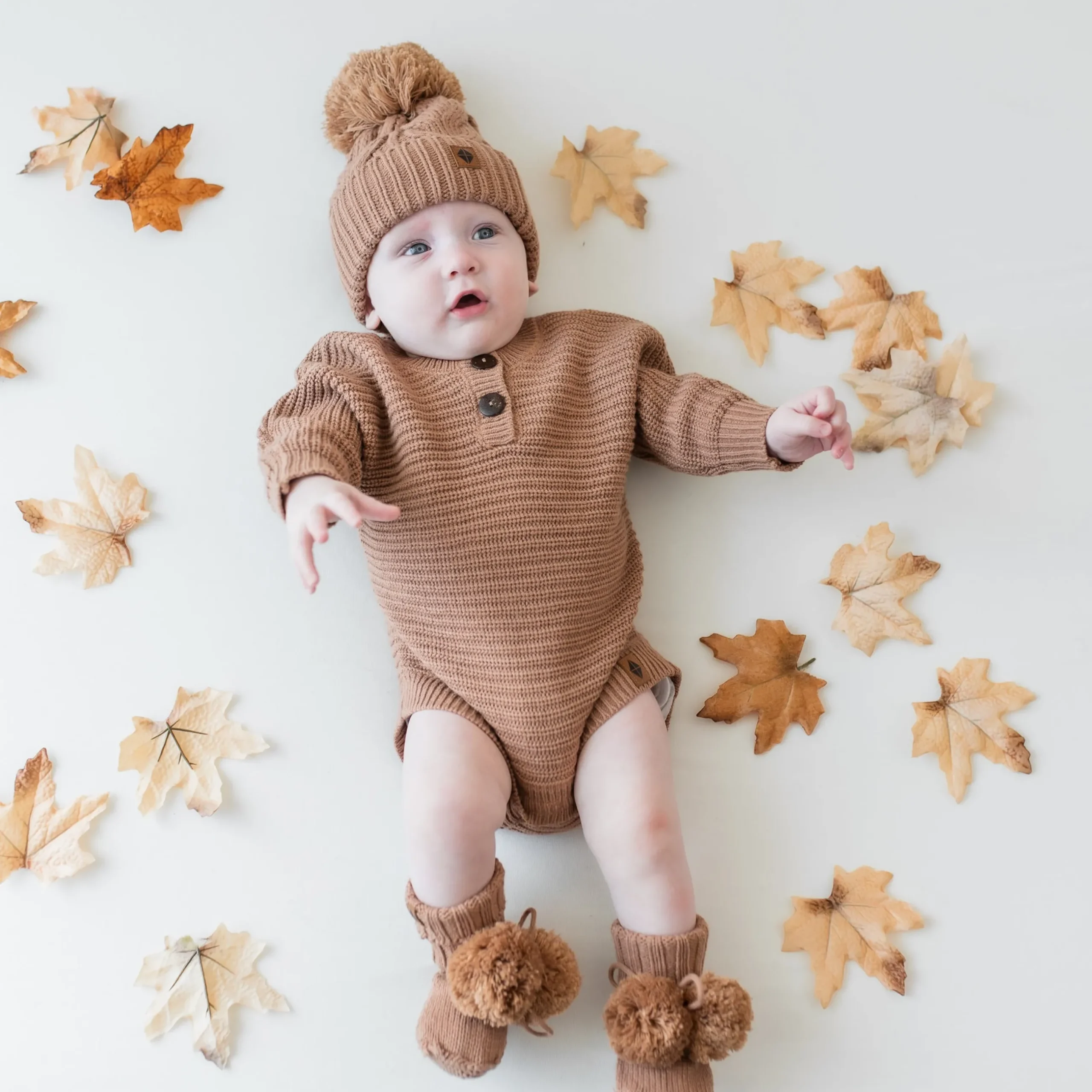 Best Kyte Baby Chunky Knit Romper in Latte