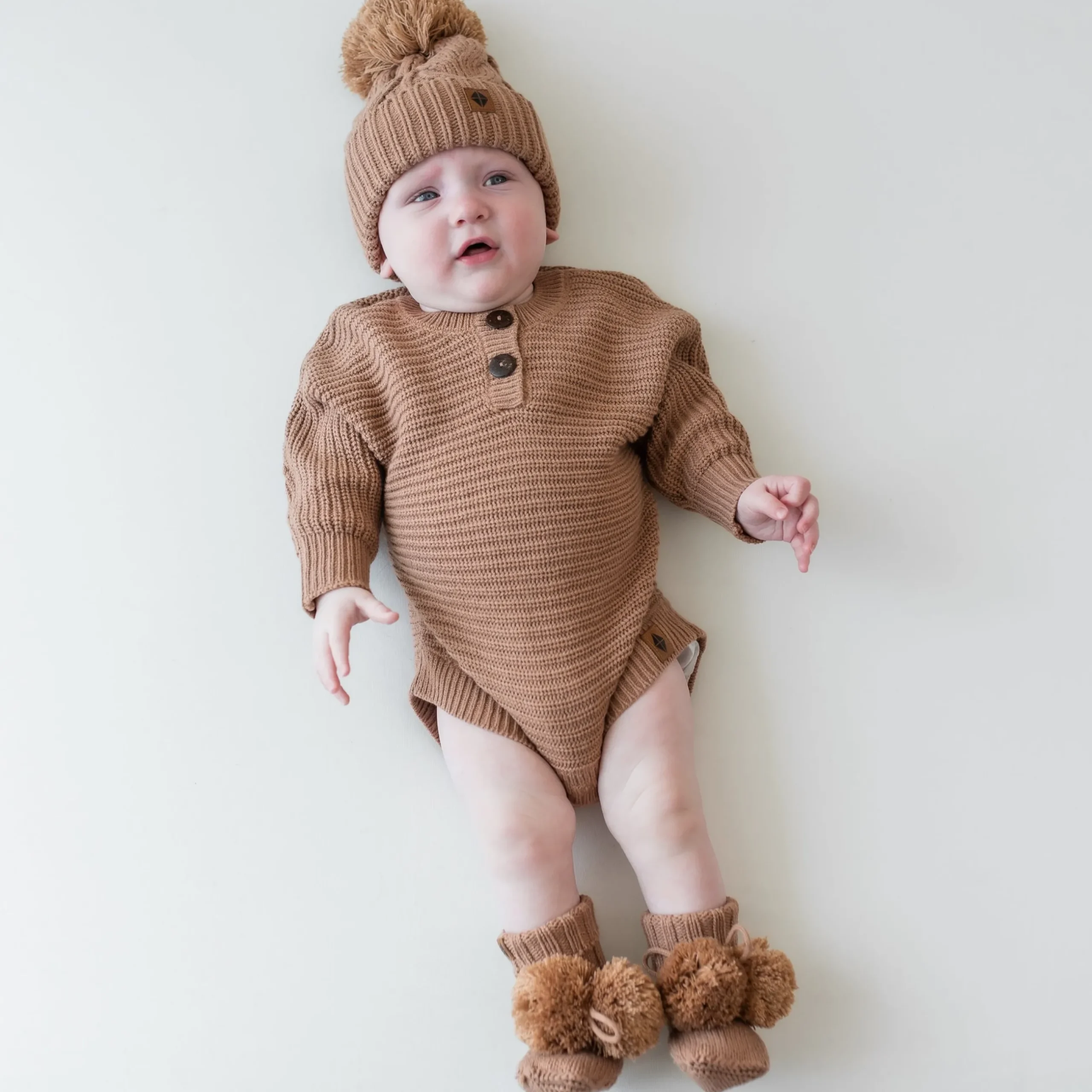 Best Kyte Baby Chunky Knit Romper in Latte