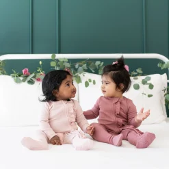 New Kyte Baby Ribbed Ruffle Zipper Footie in Blush