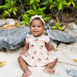 New Kyte Baby Twirl Bodysuit Dress in Peach