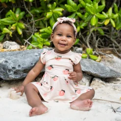 New Kyte Baby Twirl Bodysuit Dress in Peach
