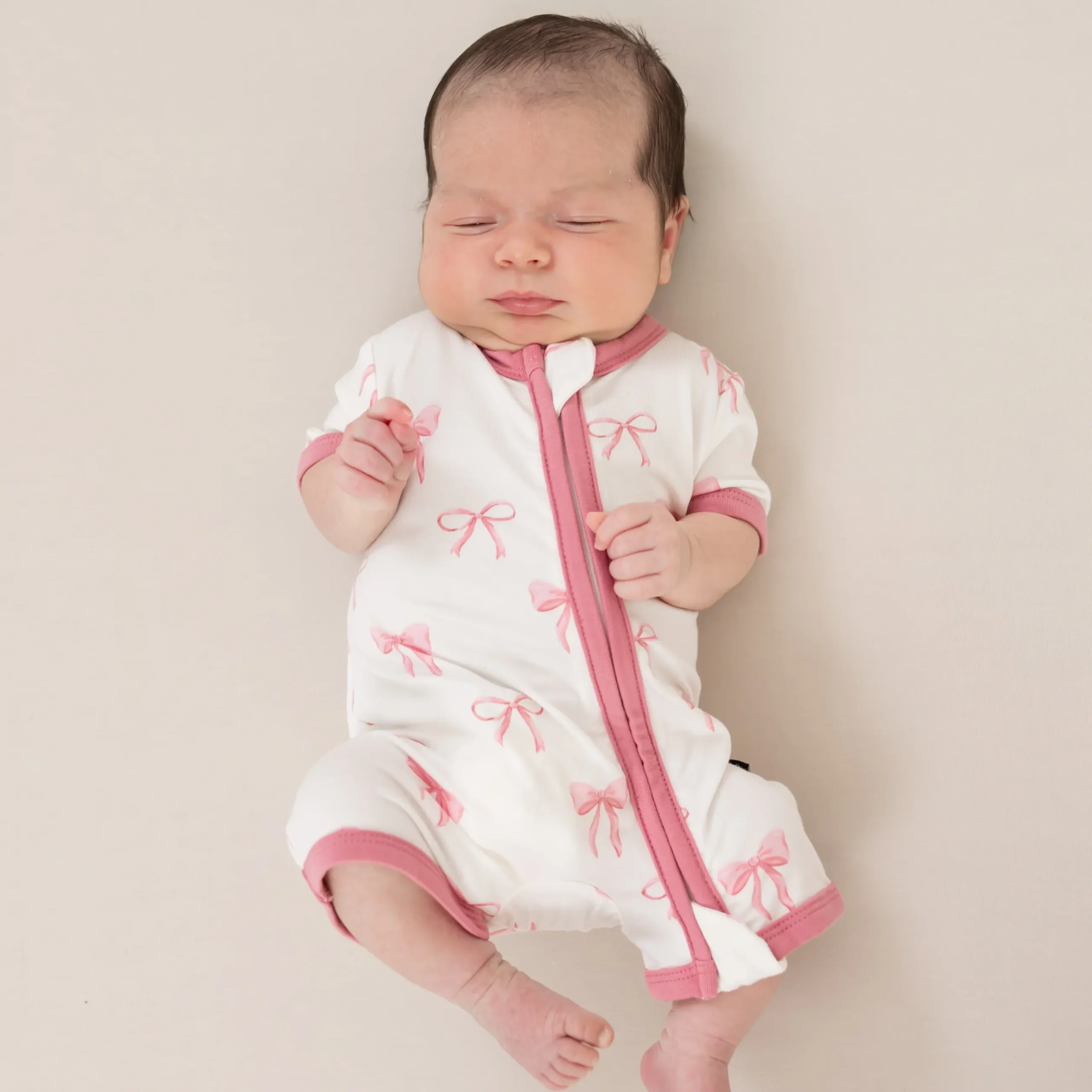 Sale Kyte Baby Zippered Shortall Romper in Bow